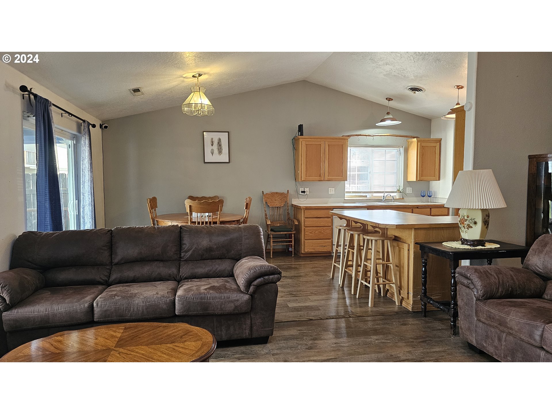 4072 Forsythia Street Springfield, OR 97478 - Photo 13 of 23 a living room with furniture and a flat screen tv