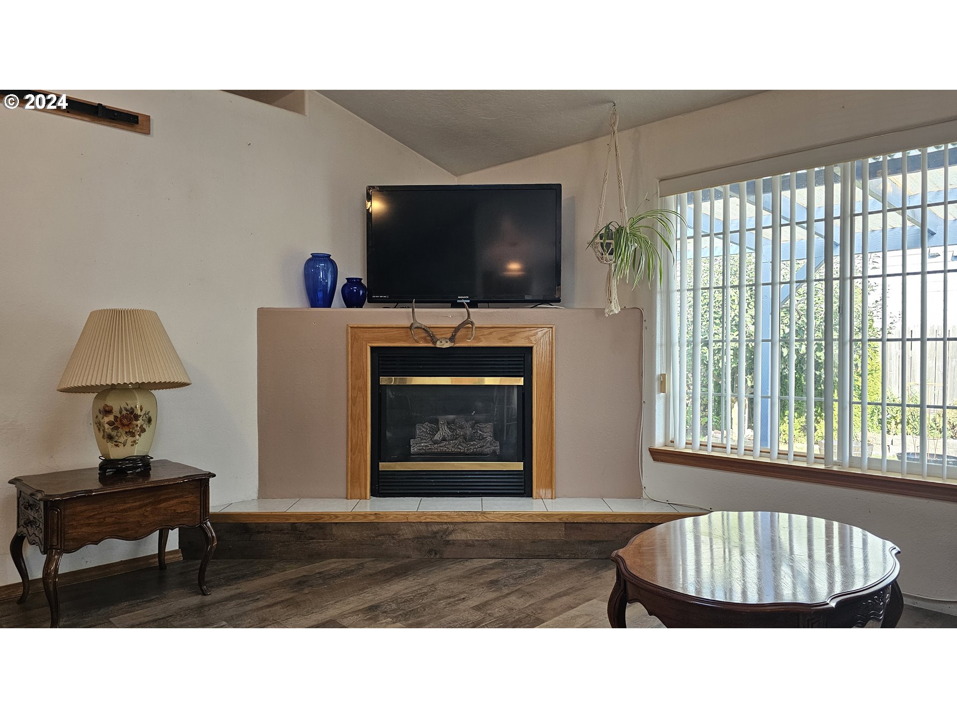 4072 Forsythia Street Springfield, OR 97478 - Photo 16 of 23 a living room with furniture and a flat screen tv