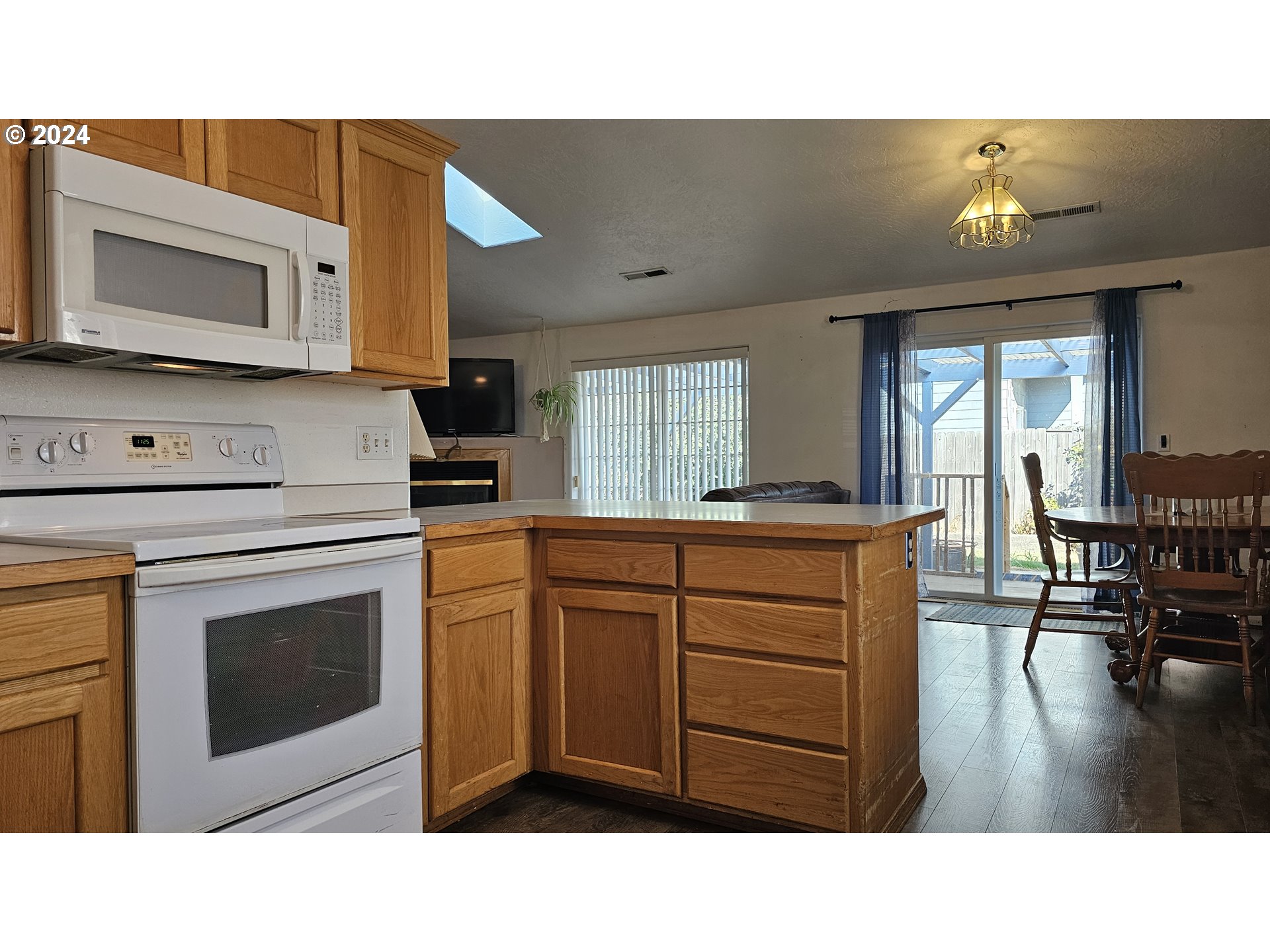 4072 Forsythia Street Springfield, OR 97478 - Photo 7 of 23 a kitchen with a sink cabinets and stainless steel appliances
