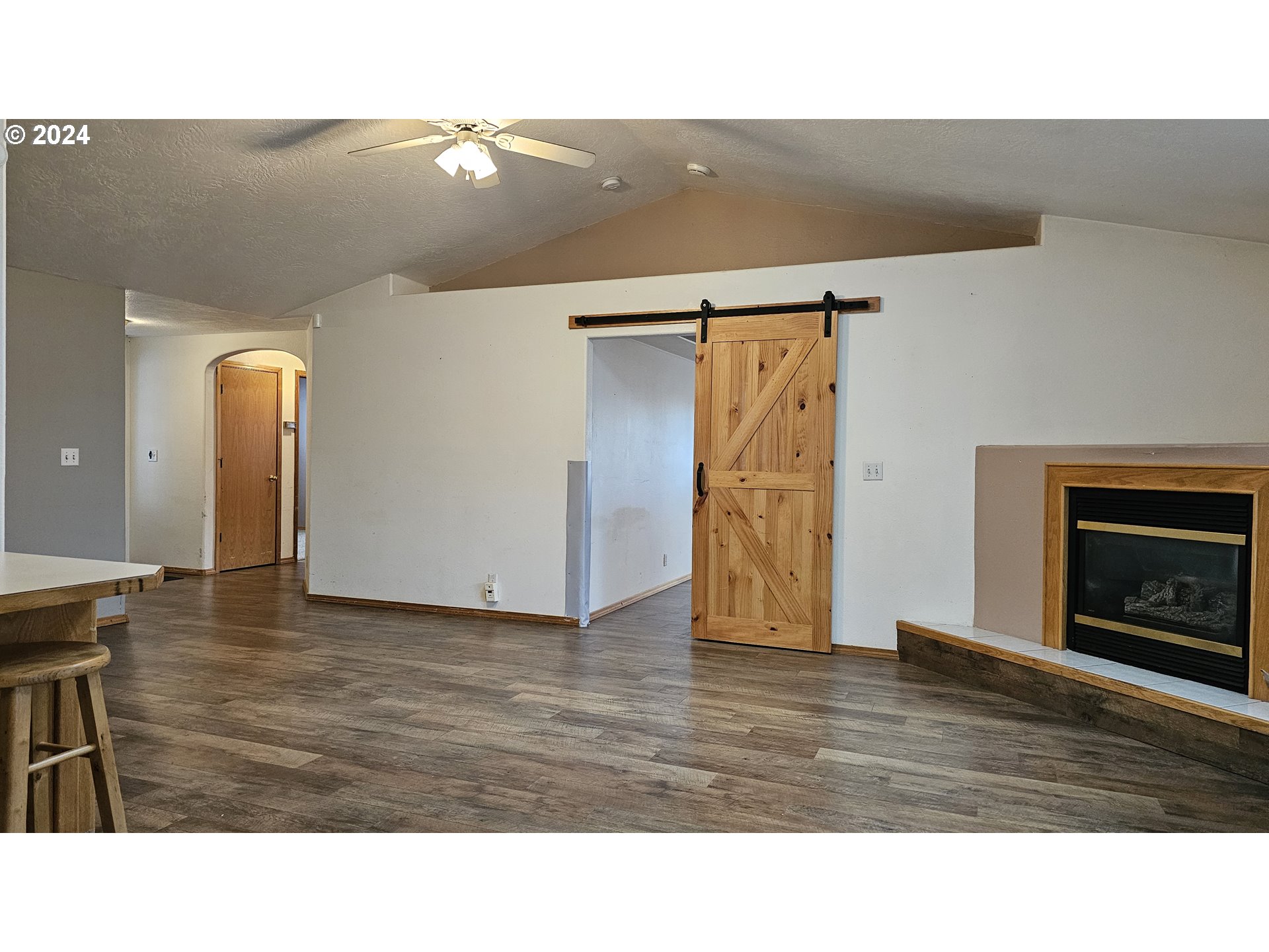 4072 Forsythia Street Springfield, OR 97478 - Photo 10 of 23 a living room with furniture and a fireplace