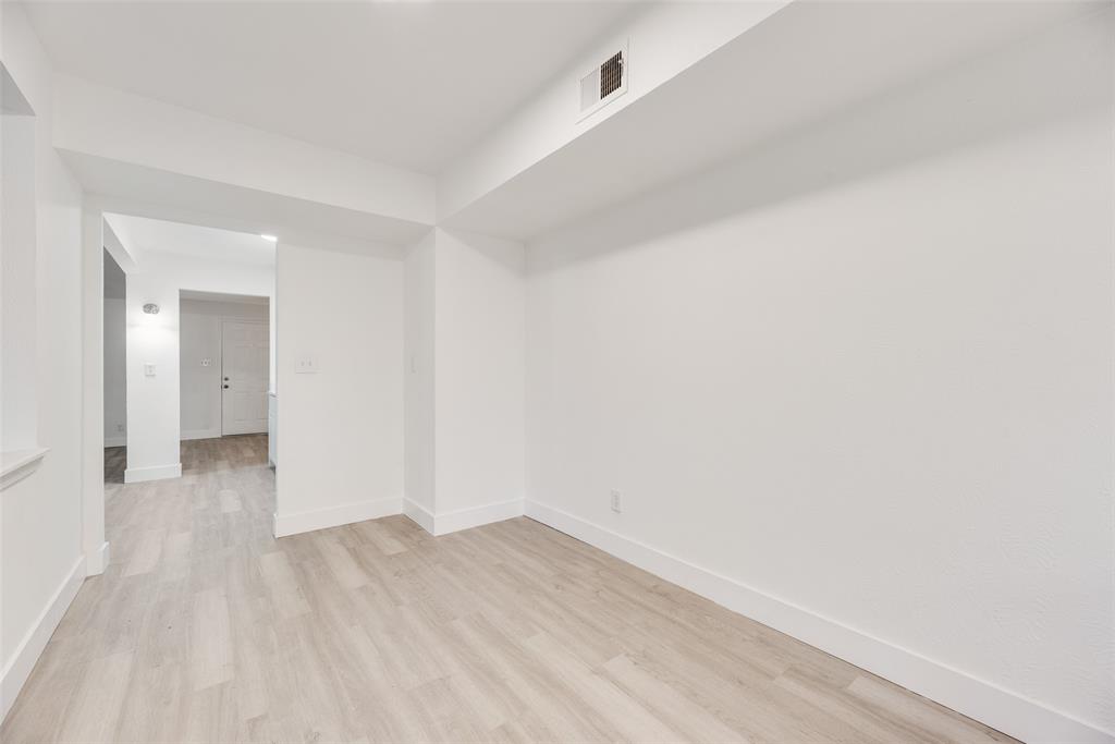 4512 Larner Street The Colony, TX 75056 - Photo 12 of 29 a view of a room with wooden floor