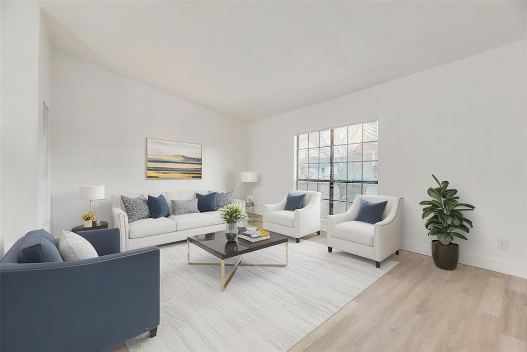4512 Larner Street The Colony, TX 75056 - Photo 2 of 29 a living room with furniture and a potted plant