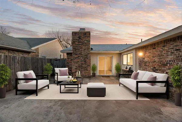 a outdoor living space with furniture and a fireplace