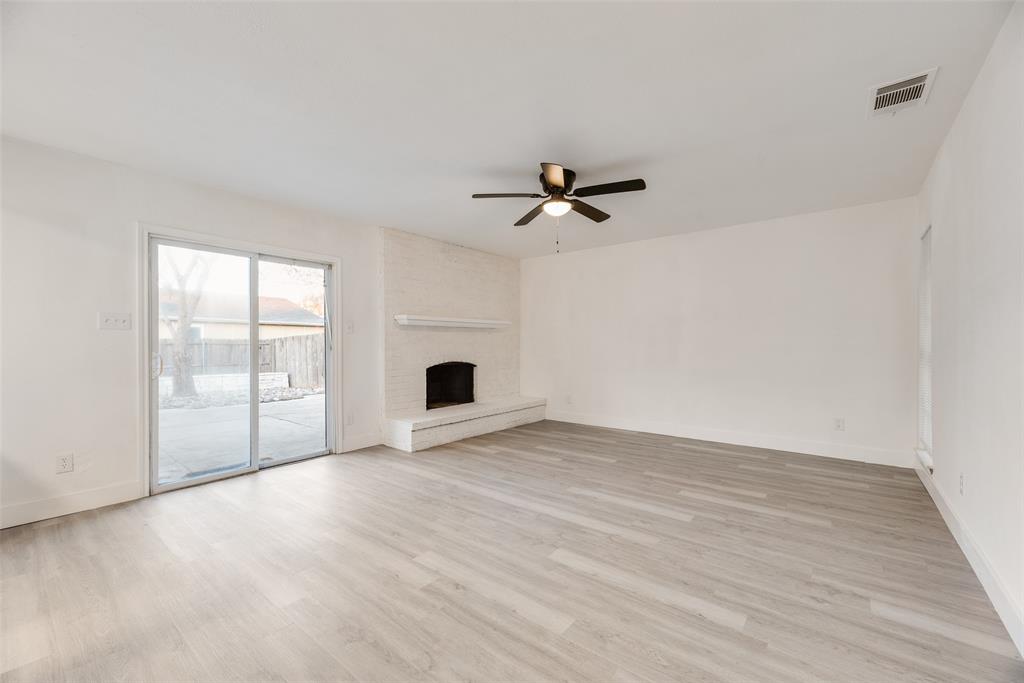 4512 Larner Street The Colony, TX 75056 - Photo 10 of 29 a view of an empty room with glass door