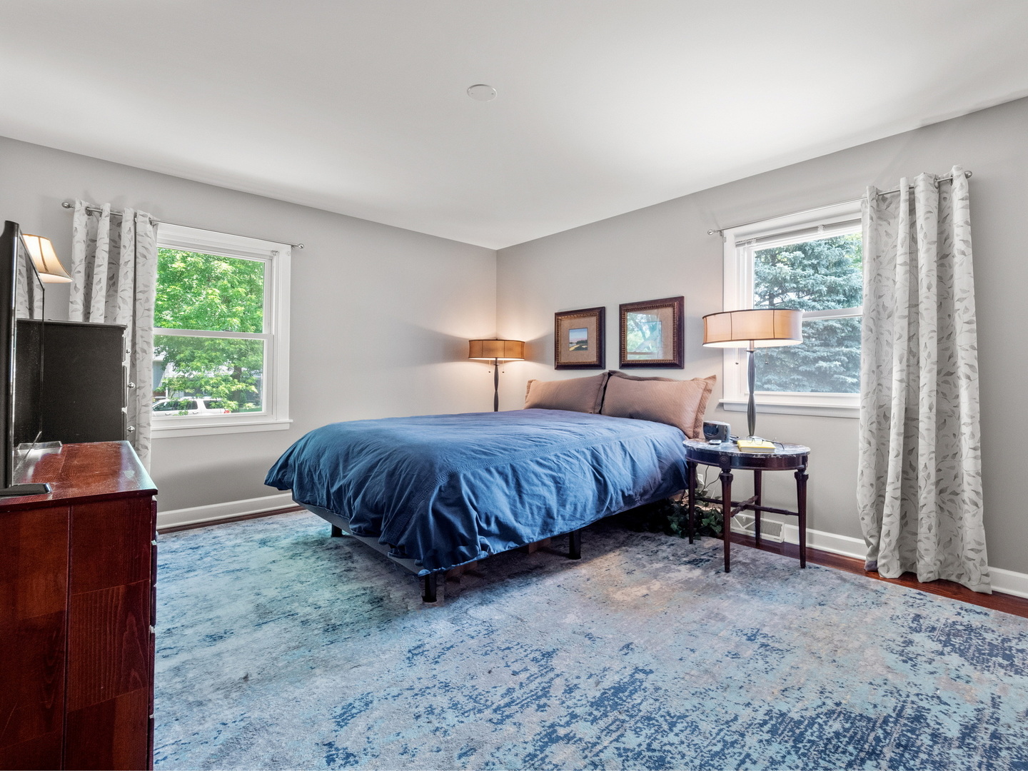 N208 Calvin Court Winfield, IL 60190 - Photo 12 of 30 a bedroom with a large bed and a flat screen tv