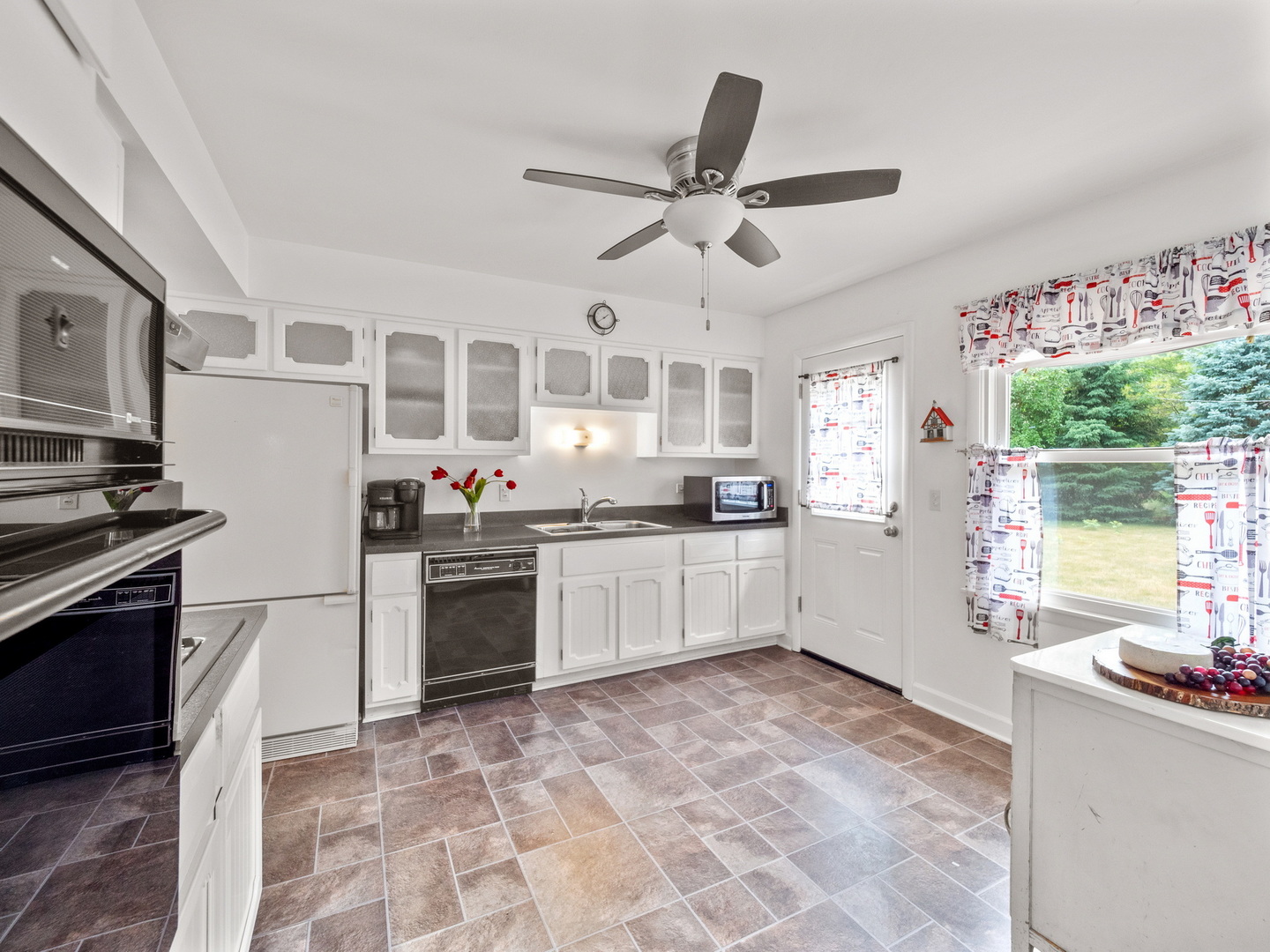 N208 Calvin Court Winfield, IL 60190 - Photo 6 of 30 a kitchen with stainless steel appliances granite countertop a stove a sink dishwasher a refrigerator a oven with white cabinets and wooden floor
