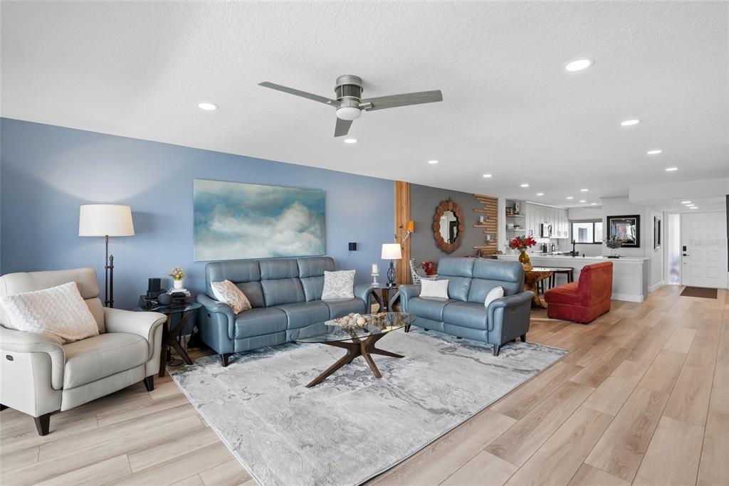 363 Pinellas Bayway South, Unit 29 Tierra Verde, FL 33715 - Photo 13 of 59 a living room with furniture and a wooden floor