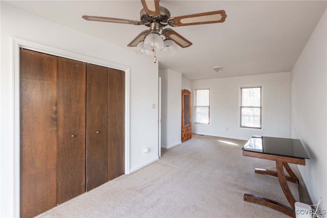 12901 Branders Bridge Road Chester, VA 23831 - Photo 12 of 28 a view of a livingroom with a window and a ceiling fan