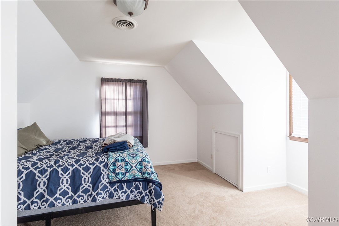 12901 Branders Bridge Road Chester, VA 23831 - Photo 18 of 28 a bedroom with a bed and a window