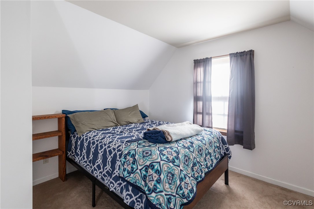 12901 Branders Bridge Road Chester, VA 23831 - Photo 19 of 28 a bedroom with a bed and a window