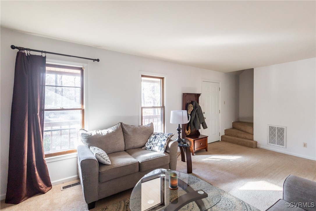 12901 Branders Bridge Road Chester, VA 23831 - Photo 6 of 28 a living room with furniture a window and gym equipment