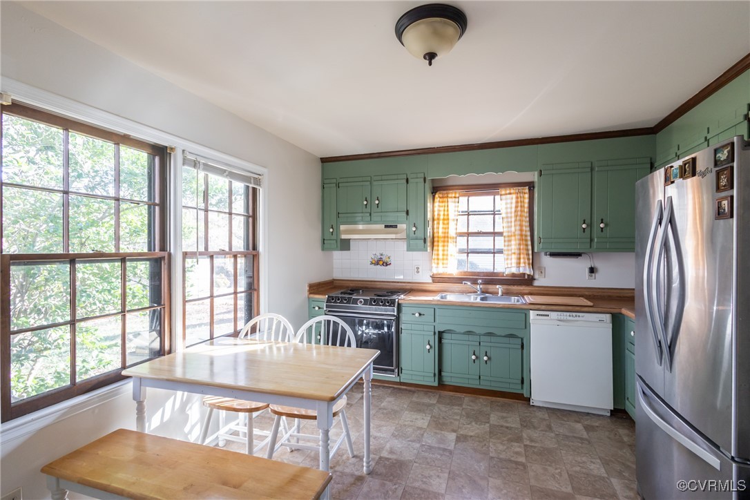 12901 Branders Bridge Road Chester, VA 23831 - Photo 8 of 28 a kitchen with a table chairs sink and refrigerator