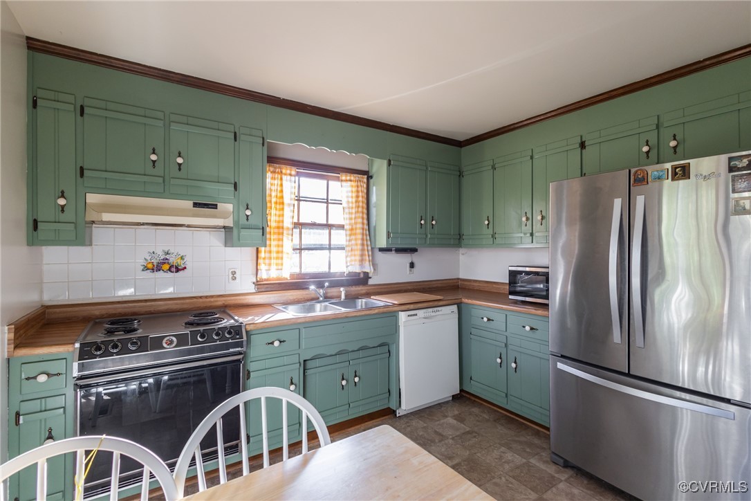 12901 Branders Bridge Road Chester, VA 23831 - Photo 9 of 28 a kitchen with stainless steel appliances granite countertop a stove a refrigerator and a sink with wooden cabinets