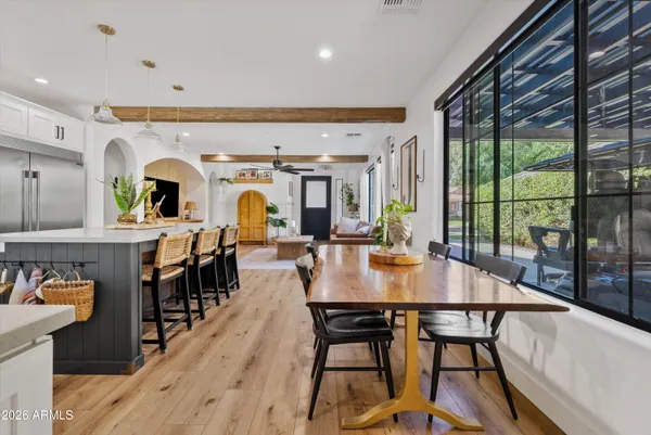 a view of a dining room with furniture window and wooden floor