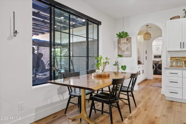 a view of a dining room with furniture and wooden floor