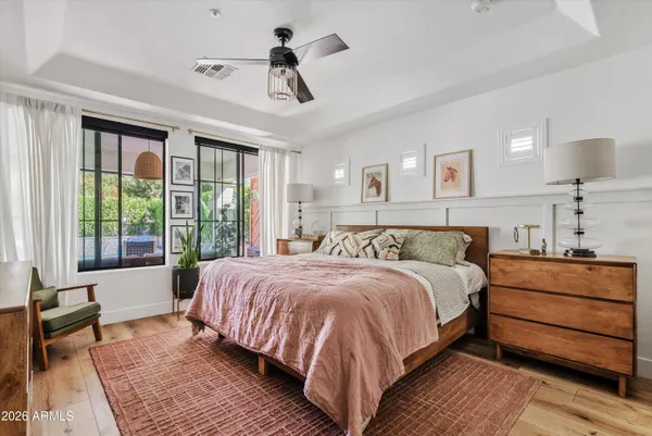 a bedroom with a large bed and a window
