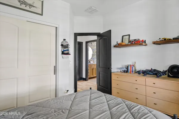 a bedroom with a bed and a cabinets