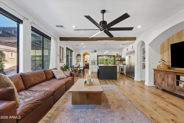 a living room with furniture and a flat screen tv