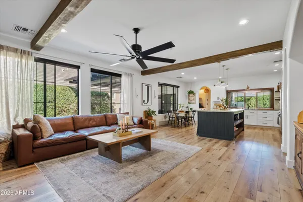 a living room with furniture and a large window