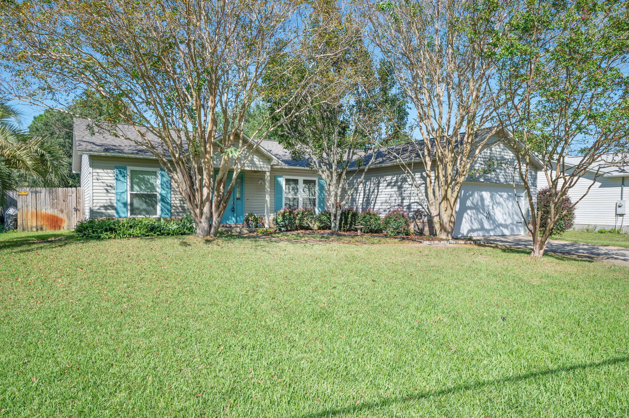 1897 Abercrombie Road Gulf Breeze, FL 32563 - Photo 1 of 1 a front view of house with yard and trees