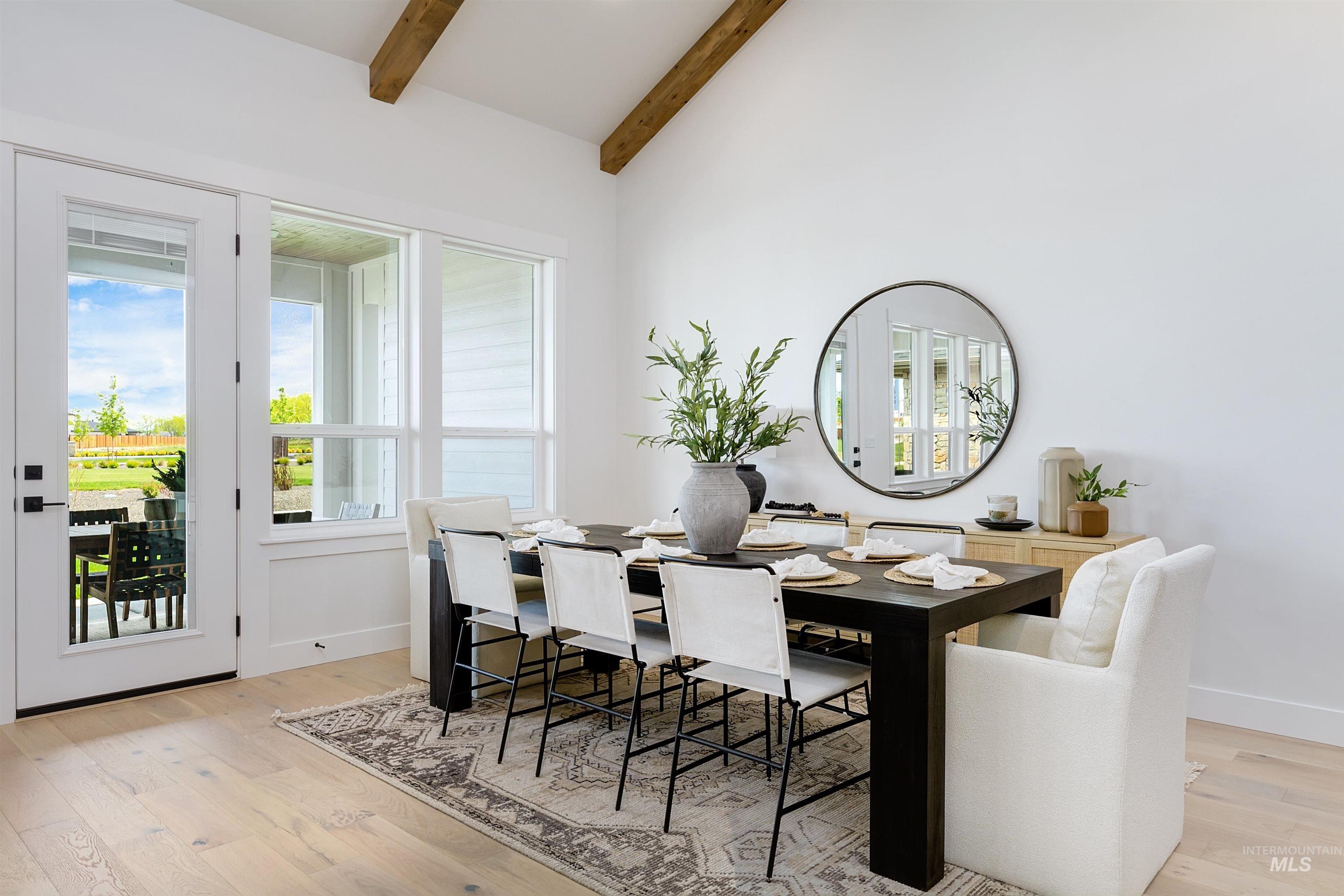 11468 South Saylis Place Kuna, ID 83634 - Photo 11 of 38 Dining area with light wood finished floors and vaulted ceiling