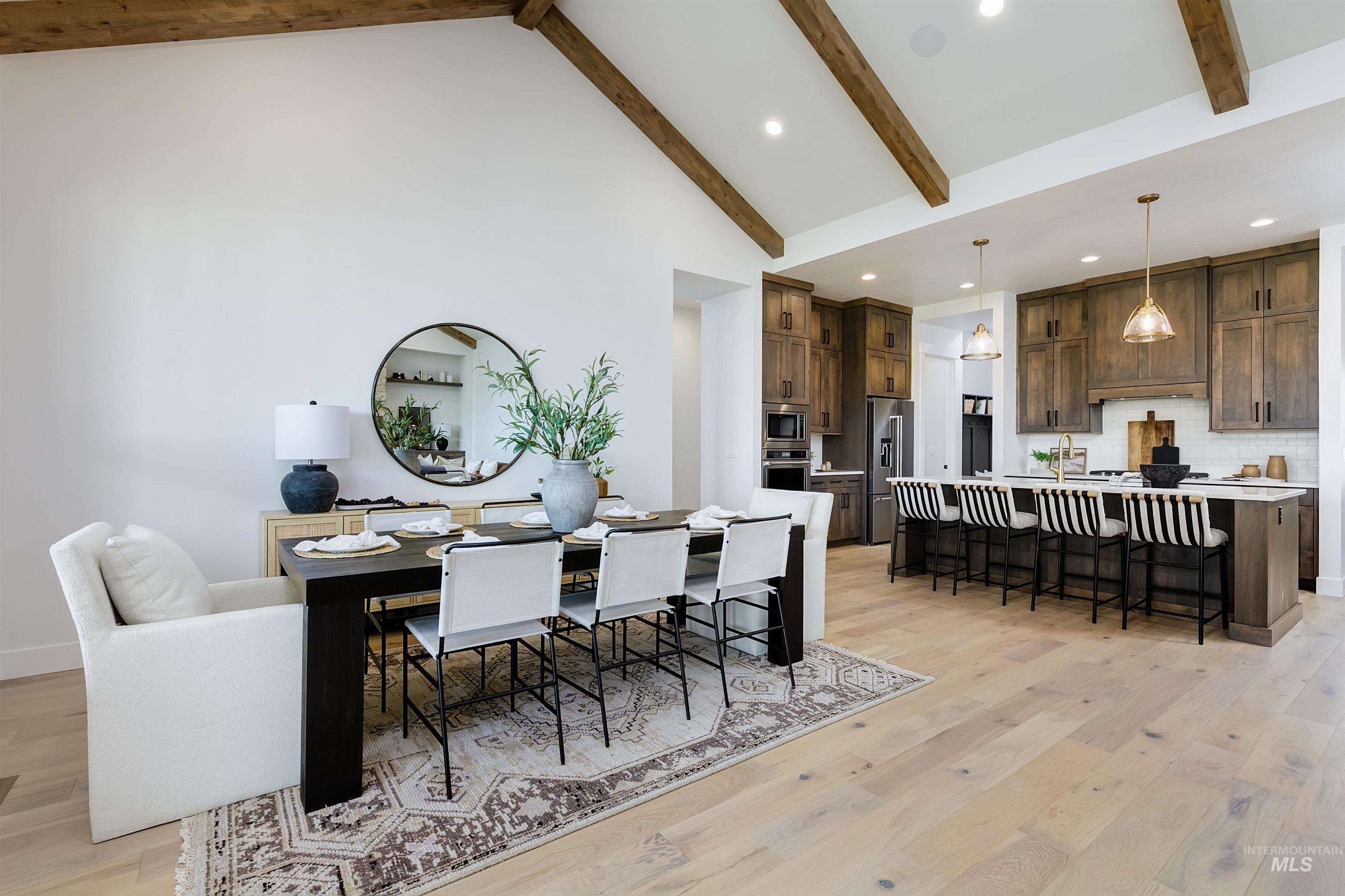 11468 South Saylis Place Kuna, ID 83634 - Photo 12 of 38 Dining room featuring recessed lighting, light wood-style floors, and vaulted ceiling