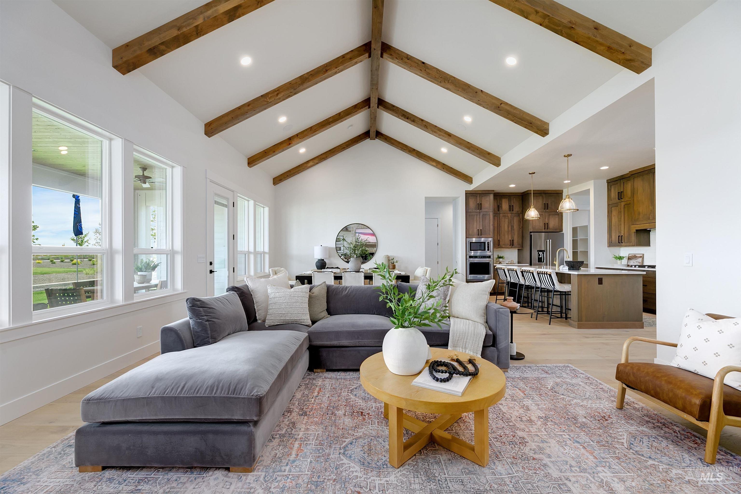 11468 South Saylis Place Kuna, ID 83634 - Photo 13 of 38 Living room featuring recessed lighting, light wood-type flooring, and a high ceiling