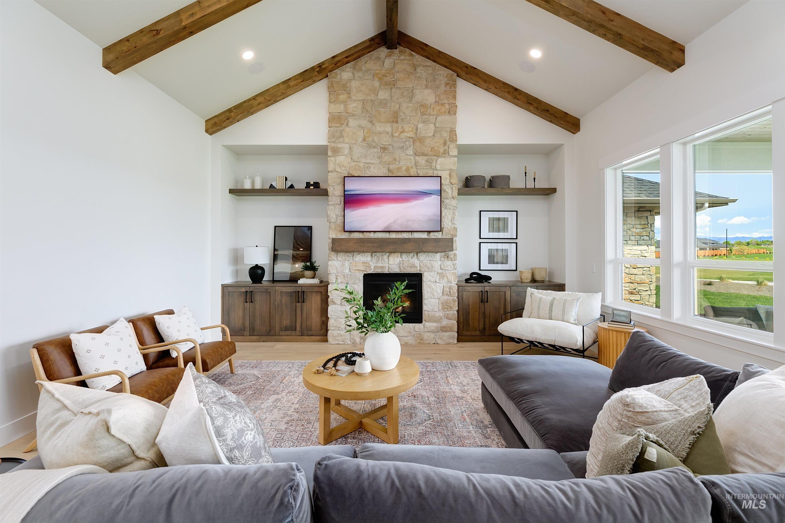 11468 South Saylis Place Kuna, ID 83634 - Photo 14 of 38 Living room featuring wood finished floors and a fireplace