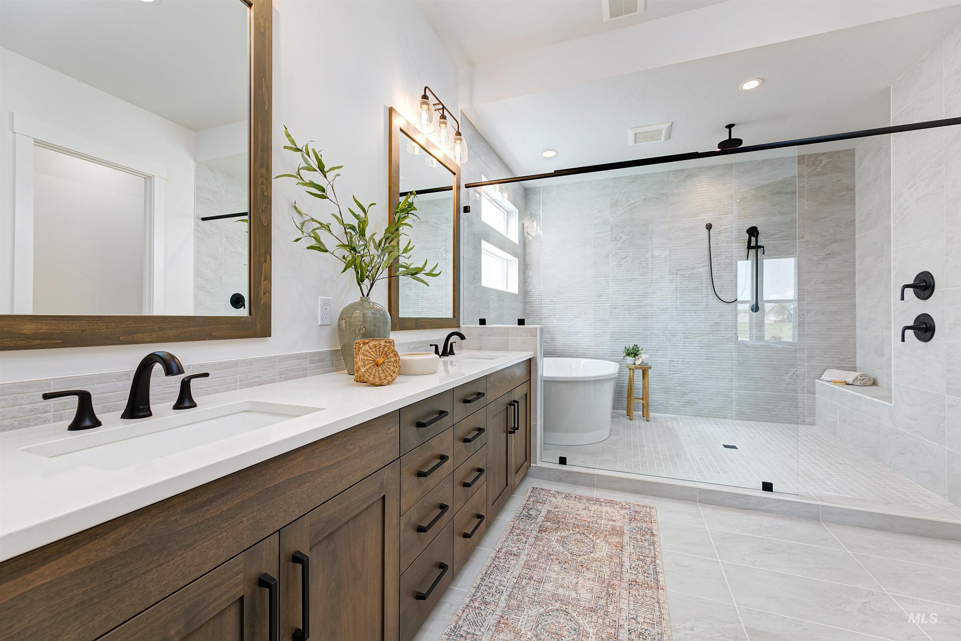 11468 South Saylis Place Kuna, ID 83634 - Photo 22 of 38 Bathroom featuring double vanity, tiled shower, a freestanding bath, light tile patterned floors, and recessed lighting