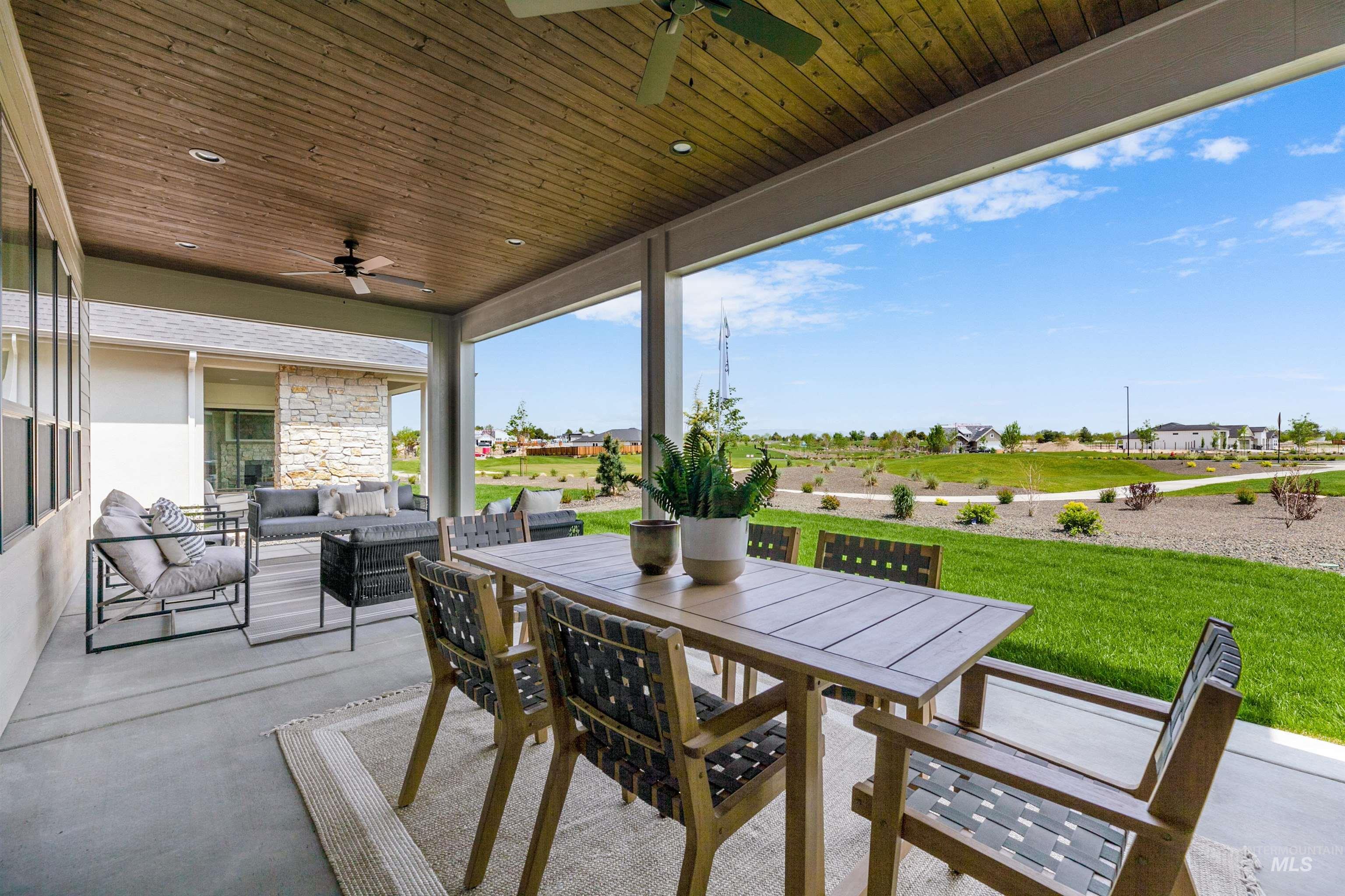 11468 South Saylis Place Kuna, ID 83634 - Photo 30 of 38 View of patio featuring a ceiling fan, an outdoor living / dining area, and a residential view