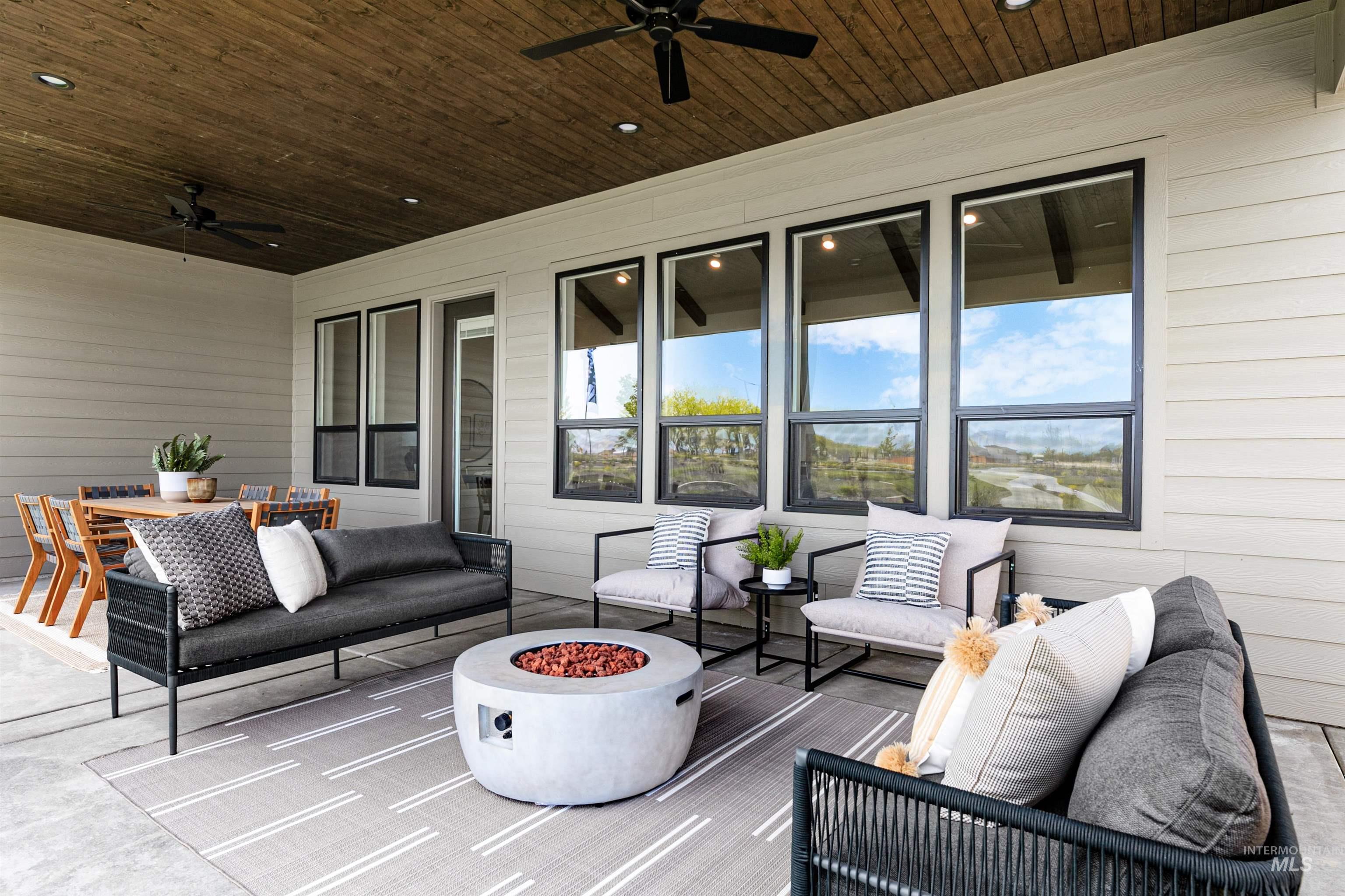 11468 South Saylis Place Kuna, ID 83634 - Photo 32 of 38 View of patio featuring an outdoor living space with a fire pit and ceiling fan
