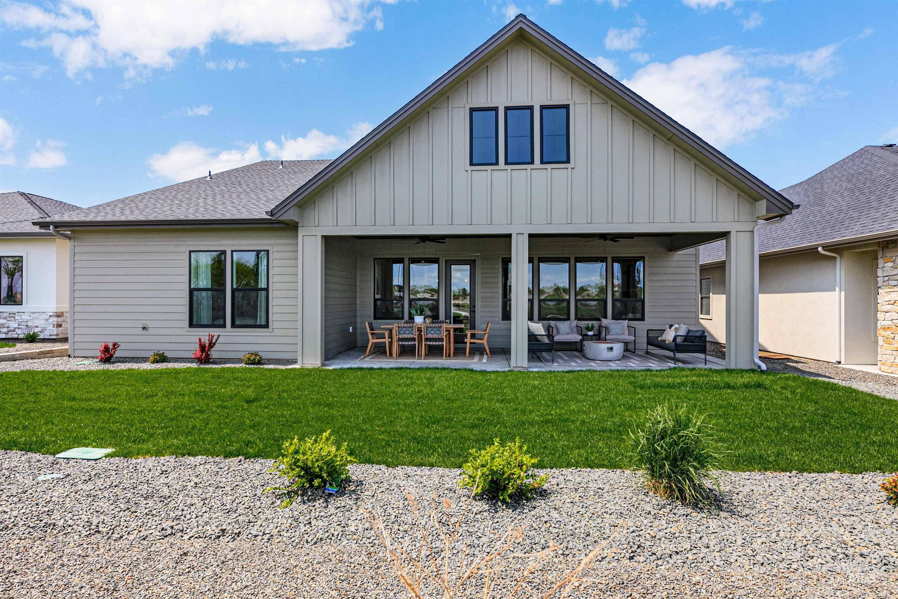 11468 South Saylis Place Kuna, ID 83634 - Photo 33 of 38 Rear view of property featuring ceiling fan, a patio, and board and batten siding