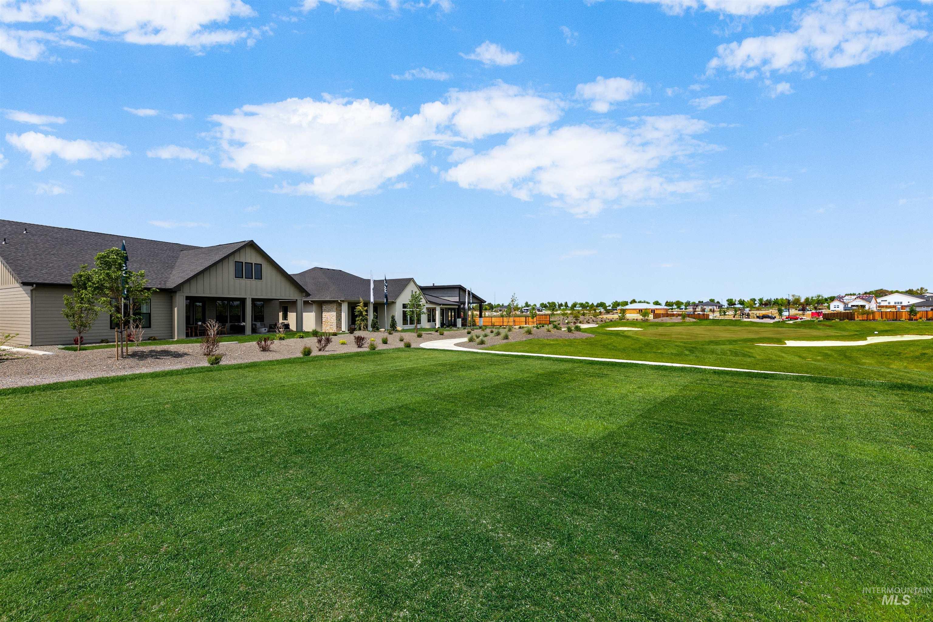 11468 South Saylis Place Kuna, ID 83634 - Photo 35 of 38 View of grassy yard featuring a residential view and a porch
