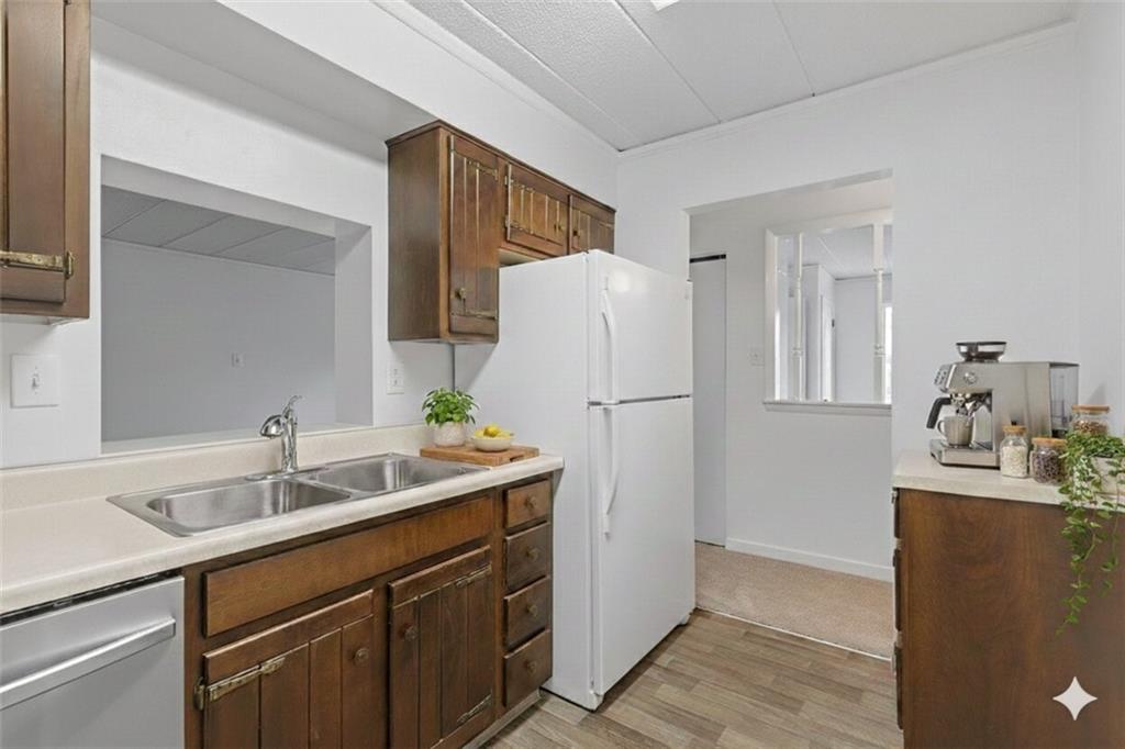 820 East Beau Street, Unit 3M Washington, PA 15301 - Photo 11 of 29 Solid wood cabinets, neutral countertops, and included appliances
