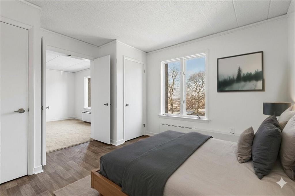 820 East Beau Street, Unit 3M Washington, PA 15301 - Photo 16 of 29 The spacious secondary bedroom with generous storage and newly upgraded flooring could also serve as a home office or den