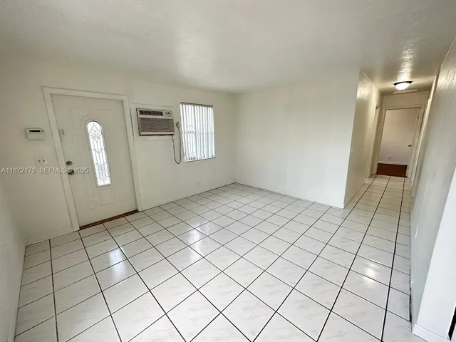 a view of an empty room and window