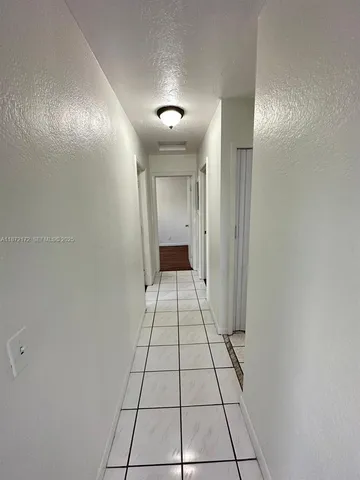 a view of a bathroom with a sink and a shower