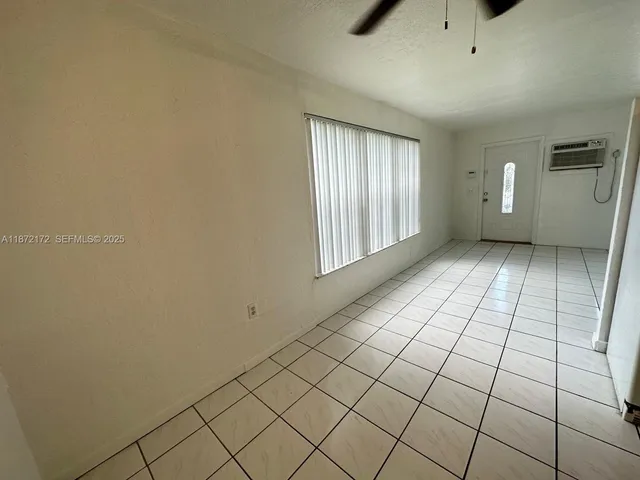 a backyard of a house with a yard and garage