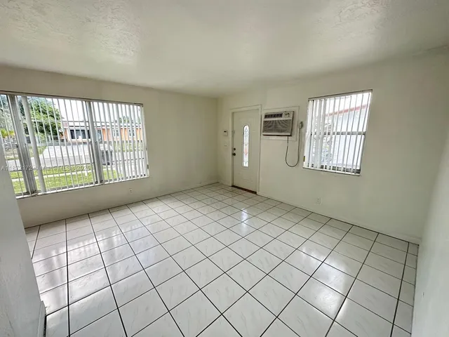 a view of an empty room and window