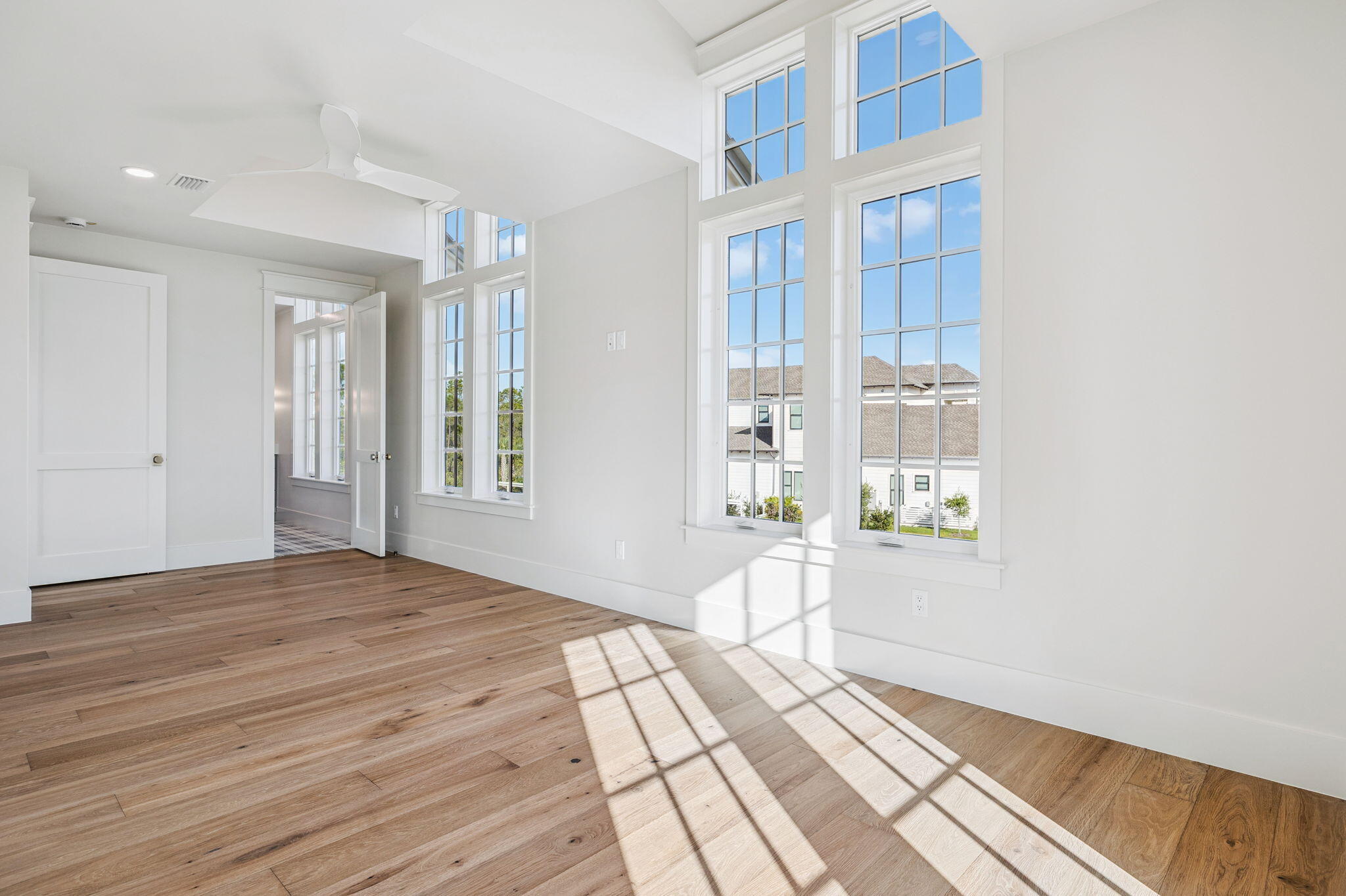 155 Golfridge Dr Inlet Beach Inlet Beach, FL 32461 - Photo 62 of 99 a view of an empty room with wooden floor and a window