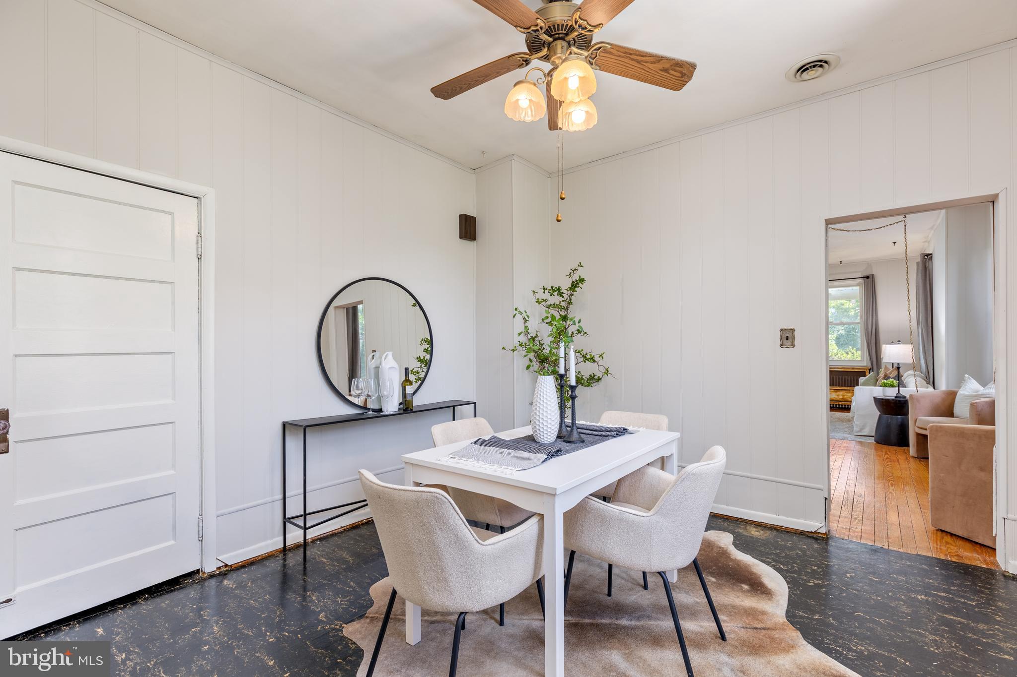 6426 Sherwood Road Baltimore, MD 21239 - Photo 11 of 43 a dining room with furniture and wooden floor