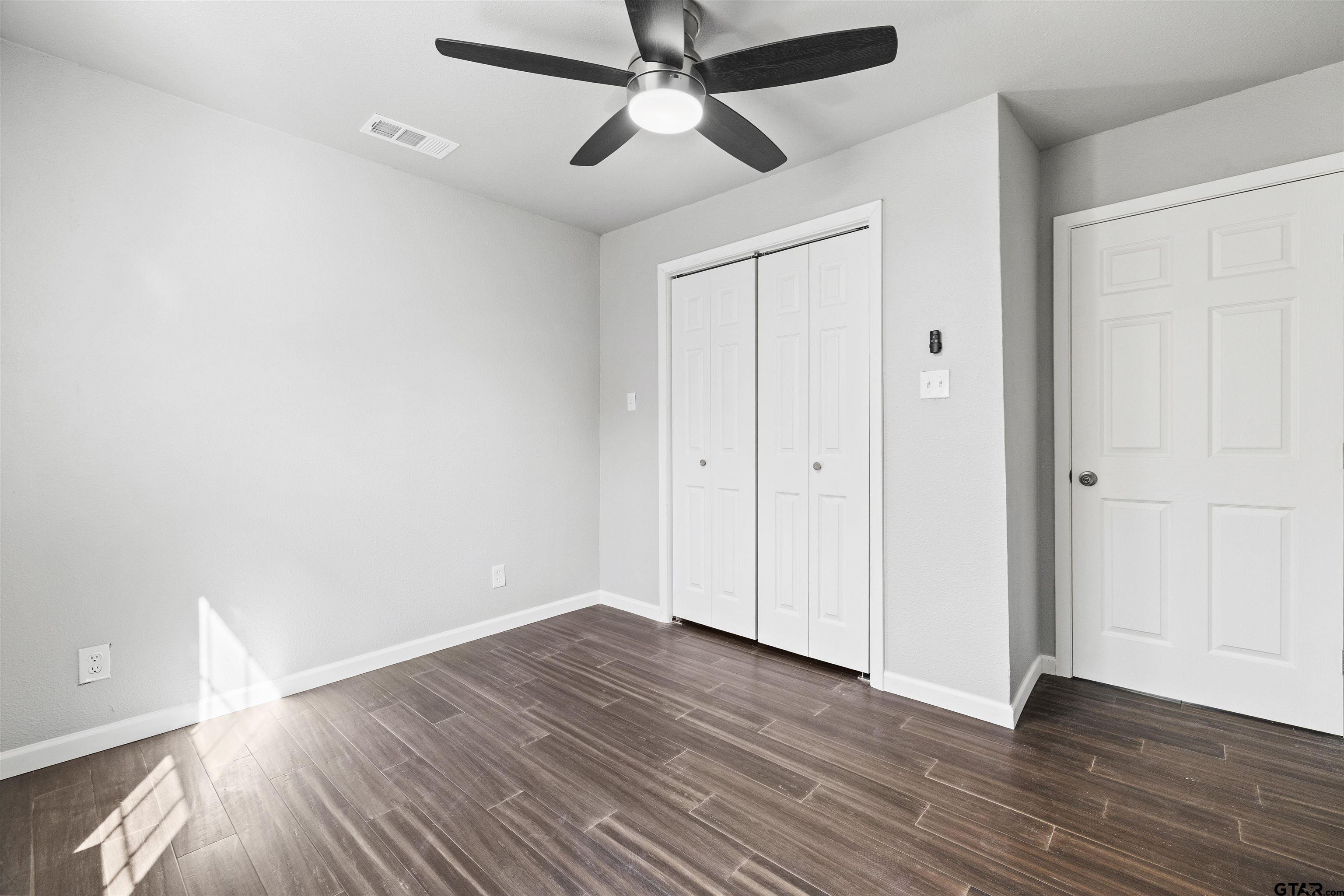 229 Orchard Street Alba, TX 75410 - Photo 12 of 16 wooden floor in an empty room