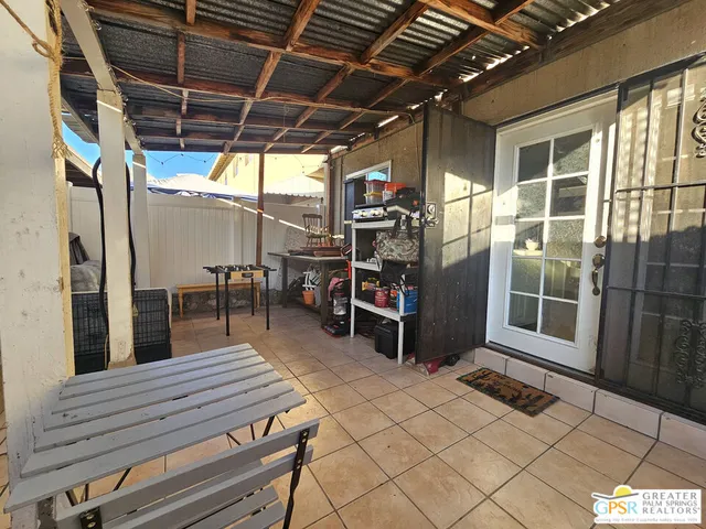 a view of a chairs and tables in the patio