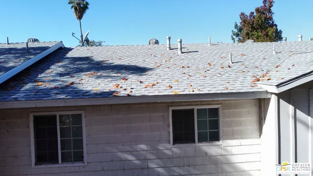 a aerial view of a house with a yard