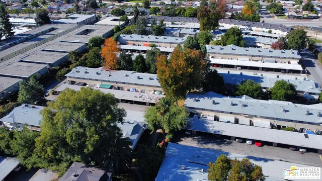 an aerial view of a house with a yard and garden