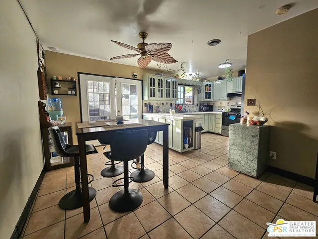 a dining room with furniture and window