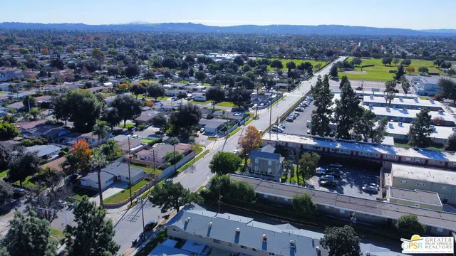 an aerial view of a houses with outdoor space