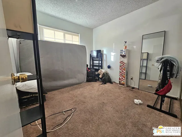 a bed room with a bed and a window