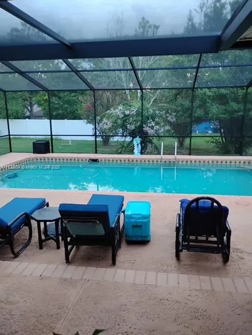 a view of yard with outdoor seating and yard