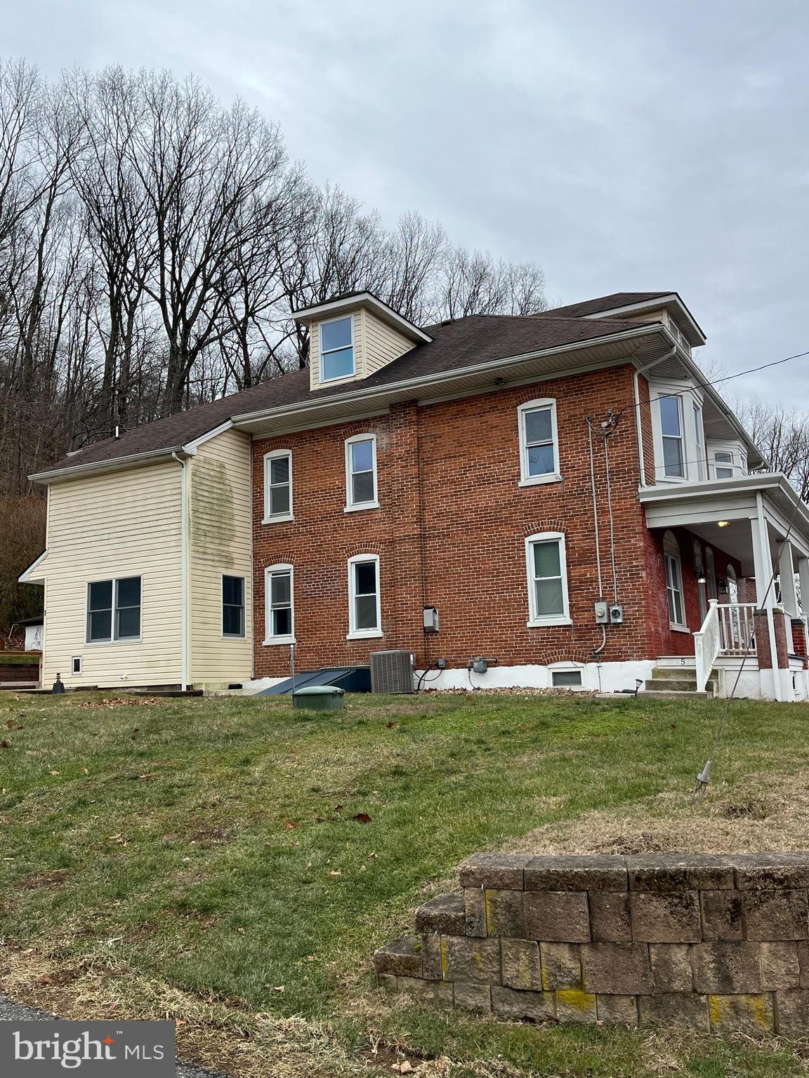 5 Ehst Road Bechtelsville, PA 19505 - Photo 2 of 23 a front view of a house with a garden
